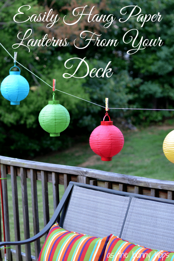 Easily hang paper lanterns from your deck with tomato stakes and twine.