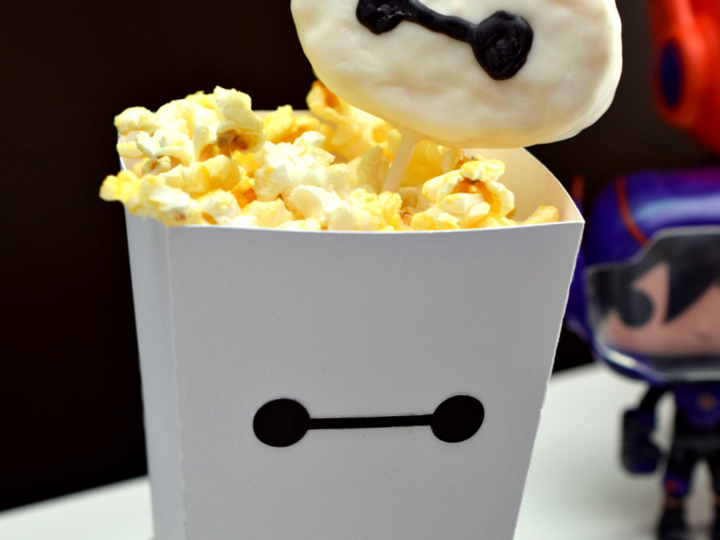 Make a fun Baymax popcorn box and rice krispie treat pop for movie night! #BigHero6Release #ad