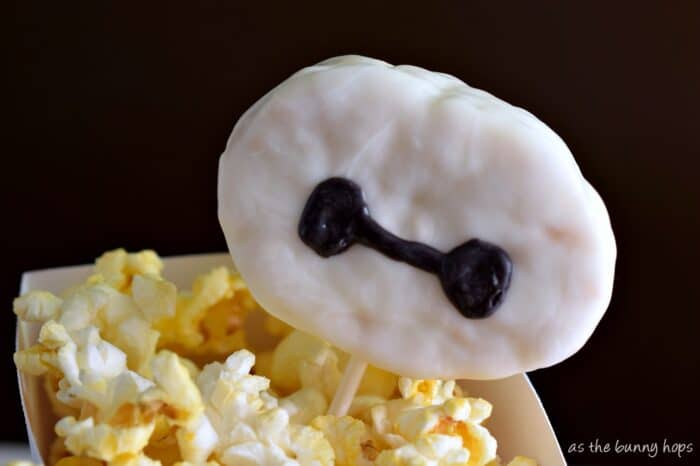 Make a fun Baymax popcorn box and rice krispie treat pop for movie night! #BigHero6Release #ad