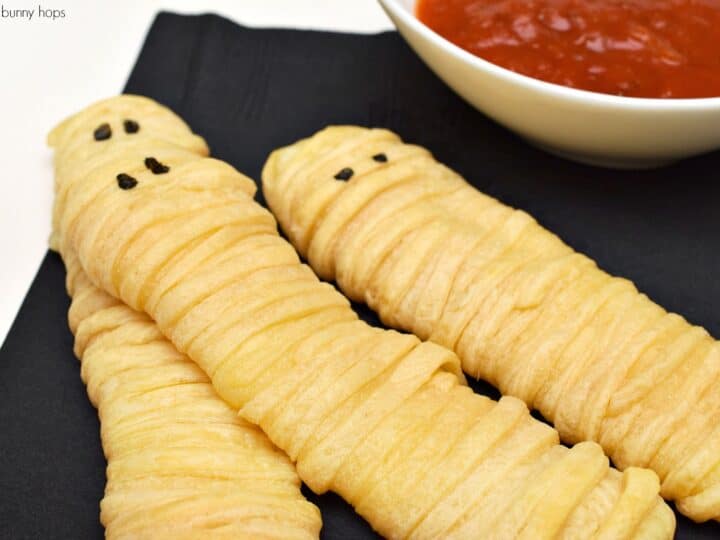 Easy to make Mummy Cheese Sticks just require string cheese and crescent rolls!