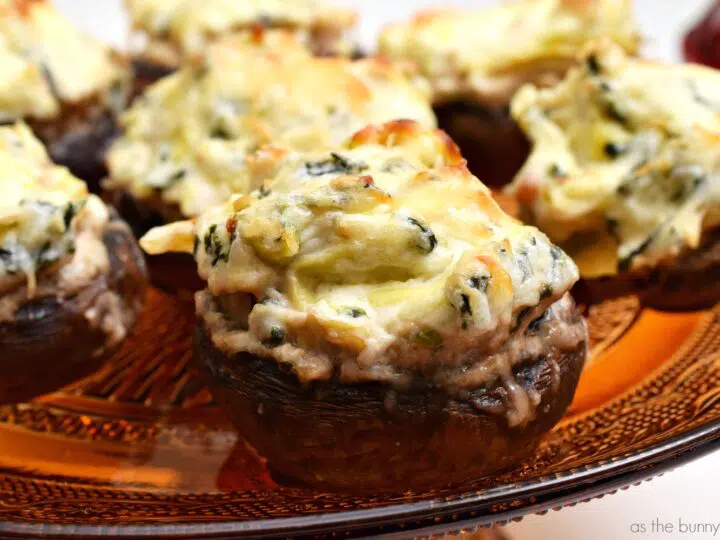 I can never get enough stuffed mushrooms! These spinach artichoke stuffed mushrooms are sure to be a hit at your next gathering.