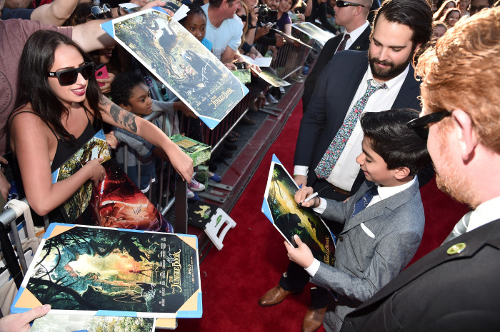 HOLLYWOOD, CALIFORNIA - APRIL 04: Actor Neel Sethi signs autographs for fans at The World Premiere of Disney's "THE JUNGLE BOOK" at the El Capitan Theatre on April 4, 2016 in Hollywood, California. (Photo by Alberto E. Rodriguez/Getty Images for Disney) *** Local Caption *** Neel Sethi