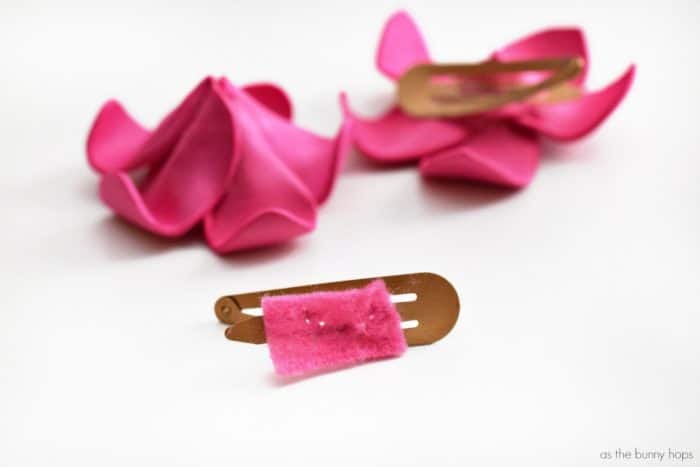 Create cute and fun DIY pink plumeria hair flowers inspired by Disney's Moana! 