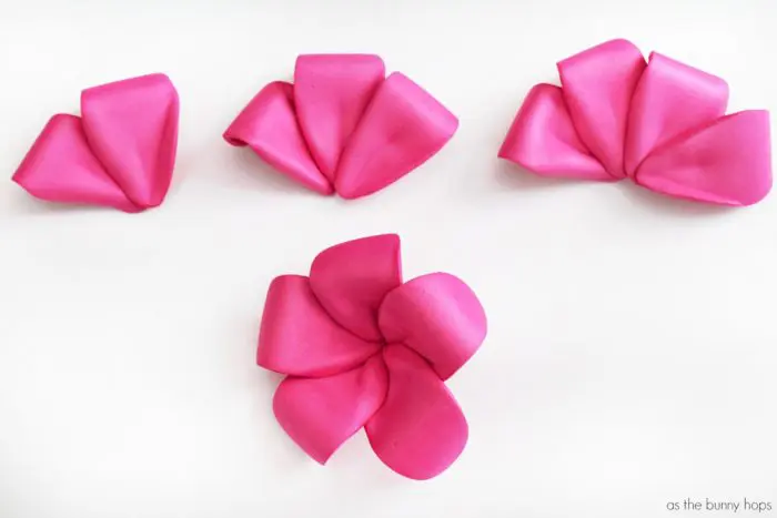 Create cute and fun DIY pink plumeria hair flowers inspired by Disney's Moana! 