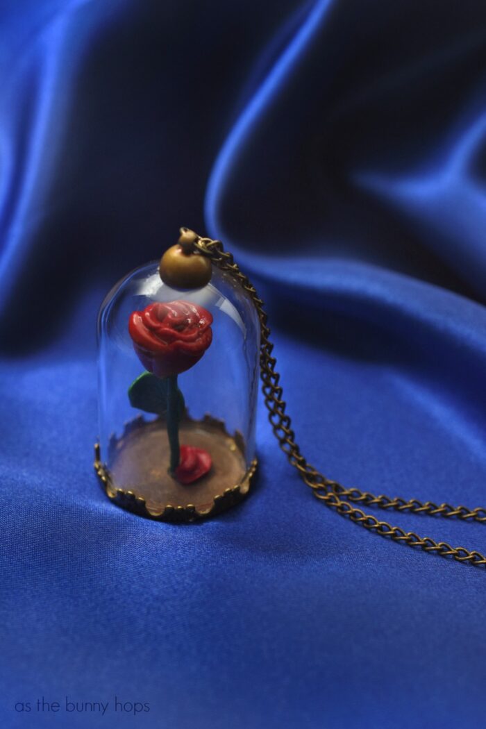 Celebrate a tale as old as time when you make a DIY Beauty and the Beast Enchanted Rose Pendant. Includes quick video and full craft instructions, along with hints on where to find the supplies.