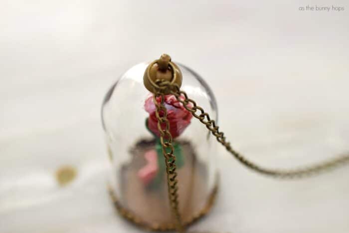 Celebrate a tale as old as time when you make a DIY Beauty and the Beast Enchanted Rose Pendant. Includes quick video and full craft instructions, along with hints on where to find the supplies.