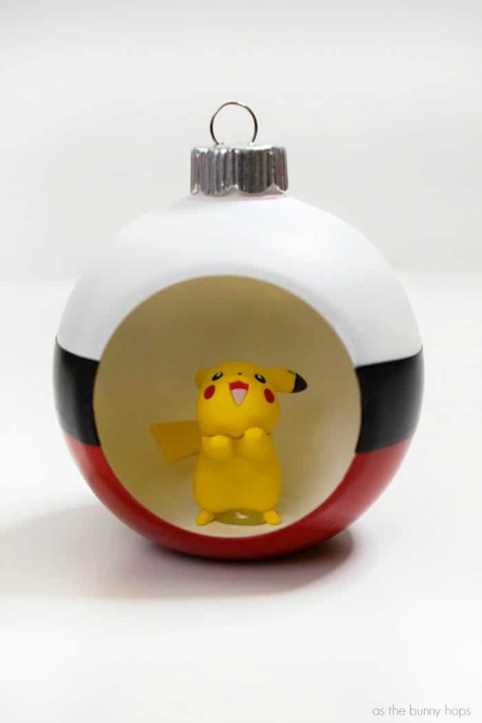 Gotta catch 'em all! Then you gotta hang 'em all on your tree with this fun DIY Poké Ball Christmas Ornament!