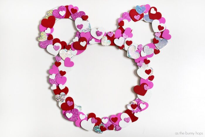 Get ready for Valentine's Day with this easy and kid-friendly Hidden Mickey Valentine Wreath craft! It's a simple Disney DIY for any skill level!