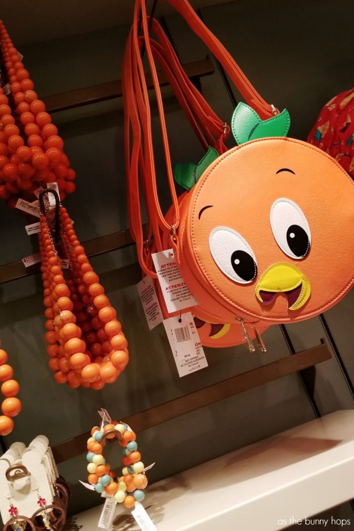 Disney Parks Exclusive Orange Bird Purse and Jewelry by the Dress Shop on display in Uptown Jewelers at Walt Disney World's Magic Kingdom. 