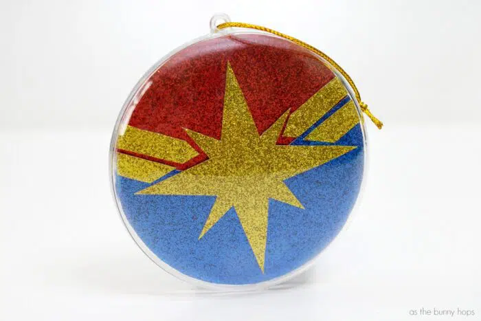 Add a little Carol Danvers to your tree with this Glittery Captain Marvel Christmas Ornament! 
