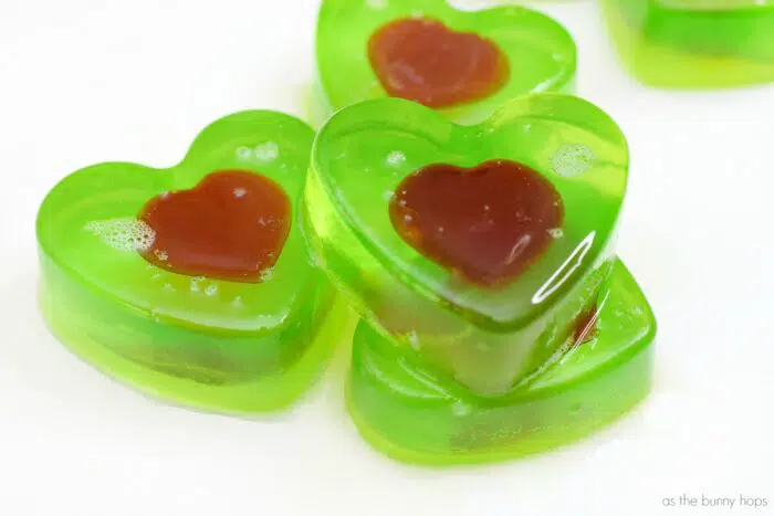 Washing their hands won't turn them grinchy when you give your little ones these easy to make Grinch Heart Soaps! 