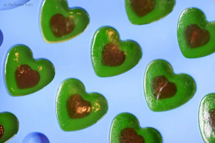 Silicion Mold with Grinch Heart Soaps. Washing their hands won't turn them grinchy when you give your little ones these easy to make Grinch Heart Soaps! 