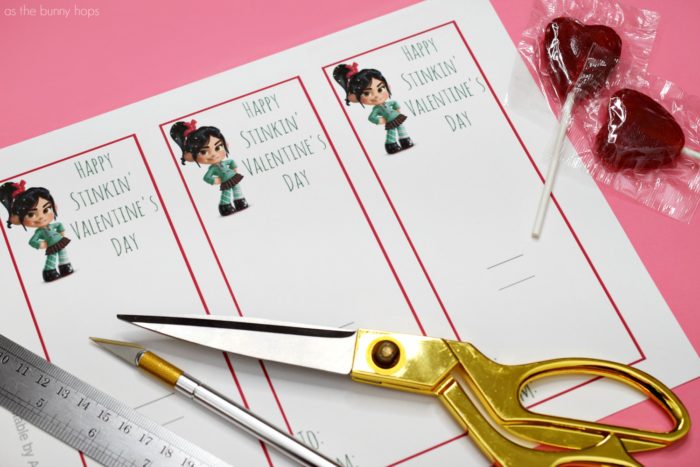 Cardstock, lollipops and scissors are all you need to make Vanellope von Schweetz Printable Valentines to hand out in class! 