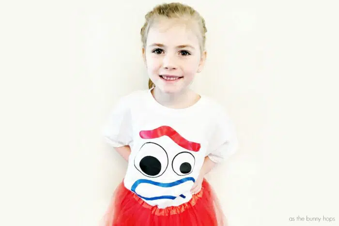 Lorie in DIY Forky T-Shirt and red tutu skirt. Dress like your new favorite toy with this easy to make DIY Forky T-Shirt! 