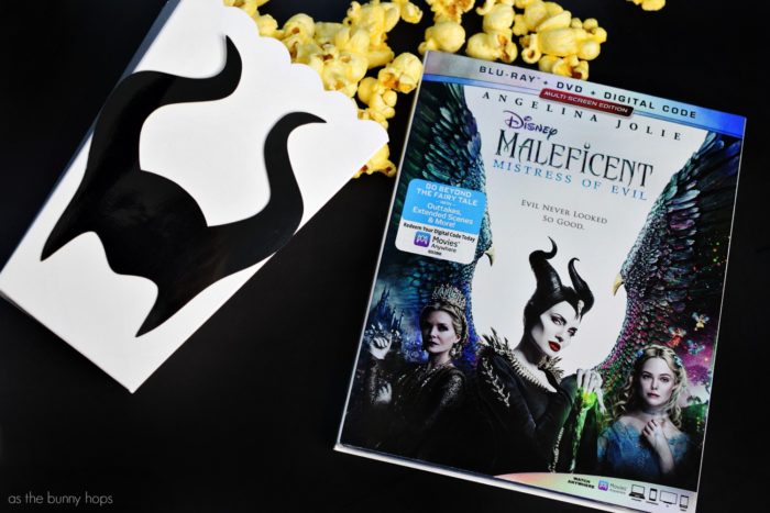Maleficent Popcorn Boxes and Maleficent: Mistress of Evil Blu-ray combo pack. Get ready for your next movie night with these Maleficent Popcorn Boxes! Hop over to As The Bunny Hops for the details on how to make this easy craft, along with a ton of Disney DIY ideas! 