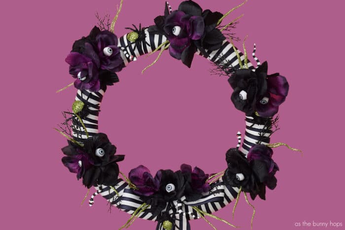 Beetlejuice inspired wreath on dusty purple background. 