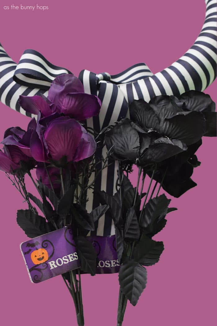 Beetlejuice inspired wreath supplies on dusty purple background. 