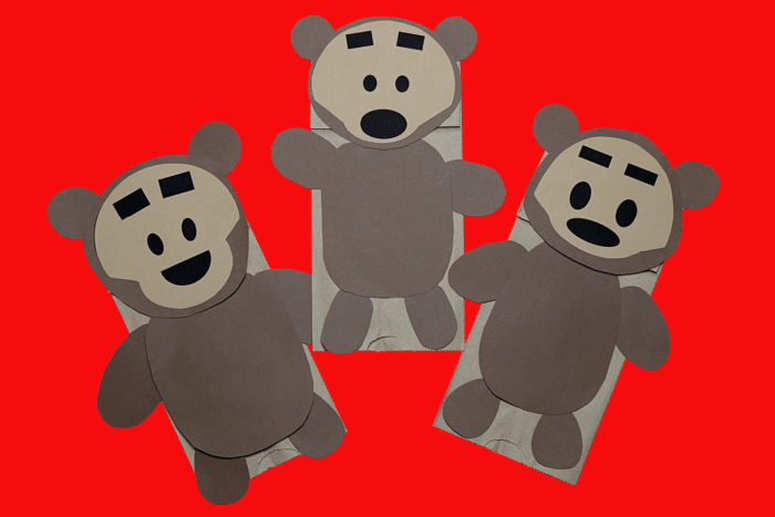 Wooden Bears Paper Bag Puppets on red background. 