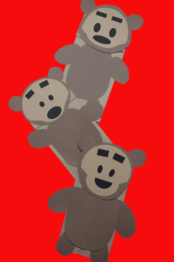 Wooden Bears Paper Bag Puppets on red background. 