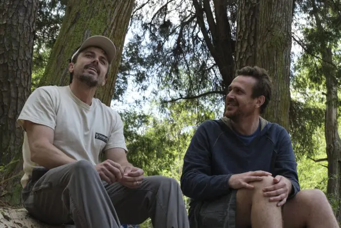 Casey Affleck and Jason Segel in the woods in "Our Friend". 