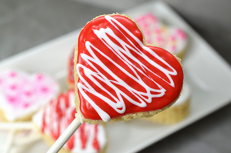 heart shaped pop with red and white icing