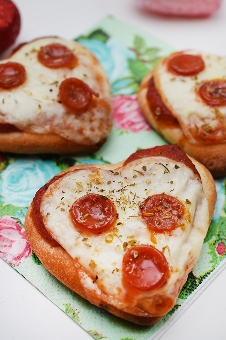 Mini, heart-shaped pizzas with pepperoni. 